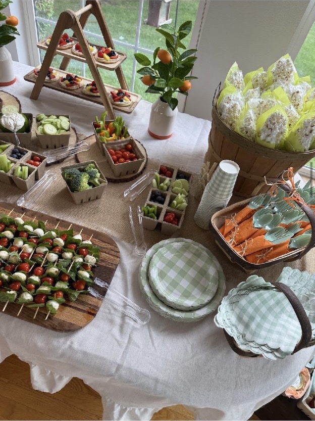 Home 6 A grazing table of caprese skewers, fresh berries and vegetables set with gingham plates